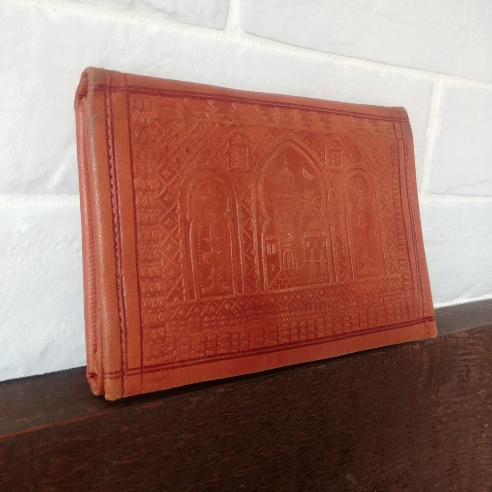 Embossed reddish brown leather multi compartment wallet